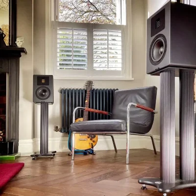 Neat Petite Classic in a music room with a guitar