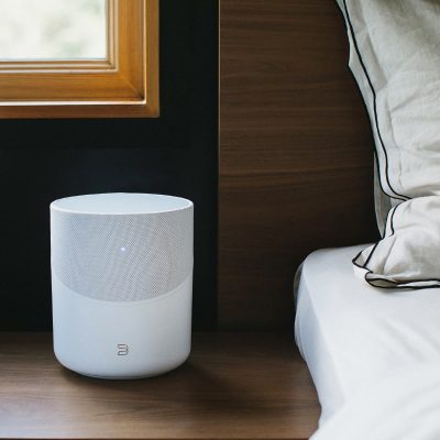 Bluesound Pulse M wireless speaker on bedside table